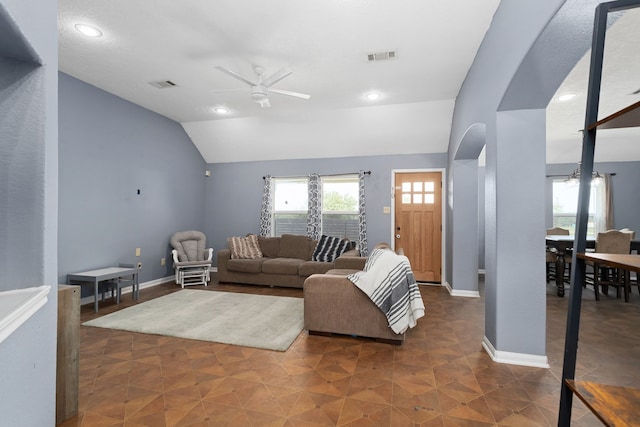 living room with ceiling fan and vaulted ceiling