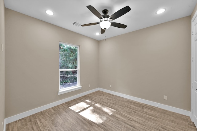 unfurnished room featuring ceiling fan and light wood-type flooring