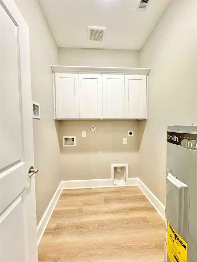 laundry area featuring hookup for a washing machine, cabinets, gas dryer hookup, electric dryer hookup, and light wood-type flooring