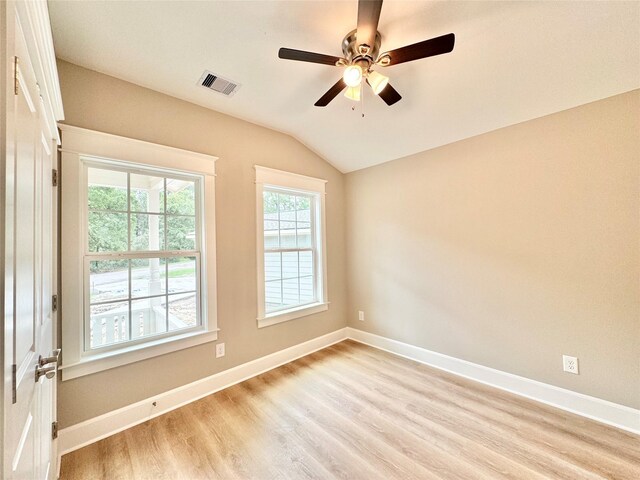 unfurnished room featuring ceiling fan, vaulted ceiling, and light hardwood / wood-style floors