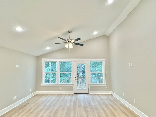 unfurnished room featuring ceiling fan, vaulted ceiling, and light hardwood / wood-style floors