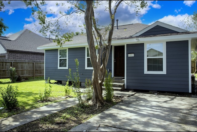 bungalow with a front lawn