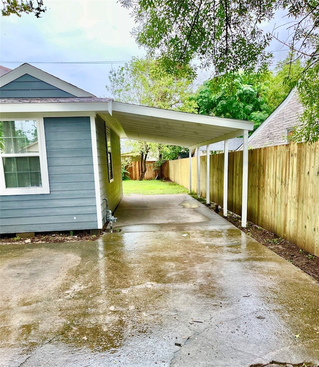 exterior space with a carport