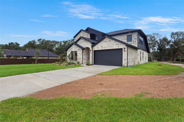 view of front facade featuring a garage and a front yard