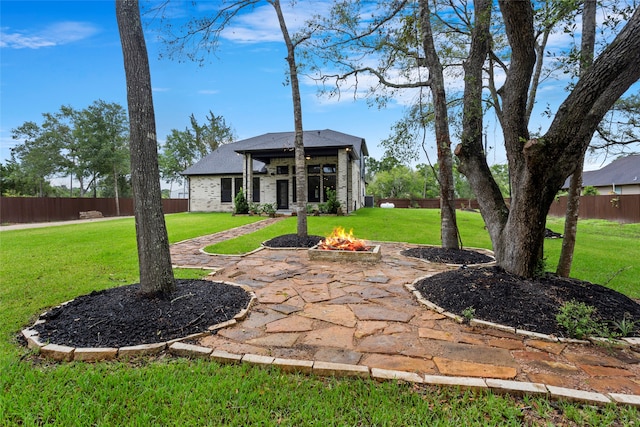 view of yard with a patio area and a fire pit