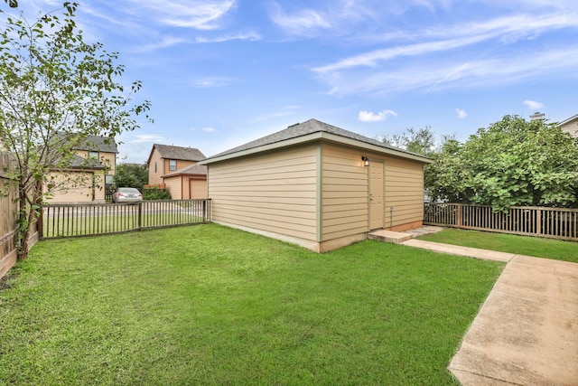 view of shed with a fenced backyard