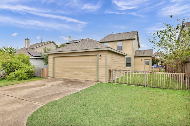 view of property exterior featuring a garage, solar panels, fence, driveway, and a lawn