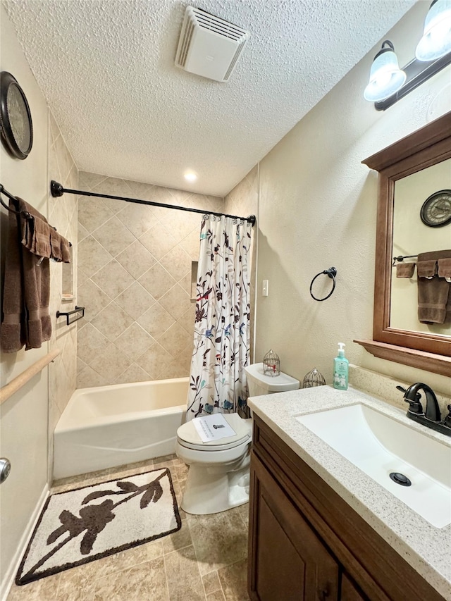 full bathroom featuring a textured ceiling, vanity, toilet, and shower / bath combination with curtain