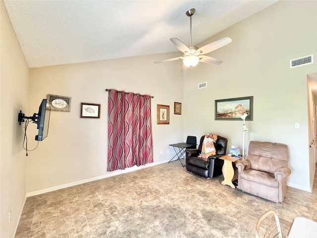 sitting room featuring a textured ceiling, ceiling fan, and high vaulted ceiling