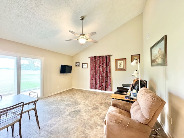 living room featuring a textured ceiling, high vaulted ceiling, and ceiling fan