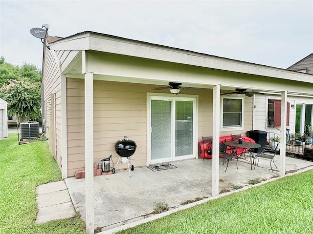 view of patio with central AC unit, area for grilling, and ceiling fan