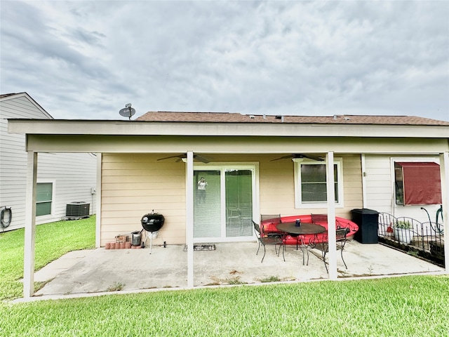 rear view of house with a yard, a patio, ceiling fan, and central air condition unit