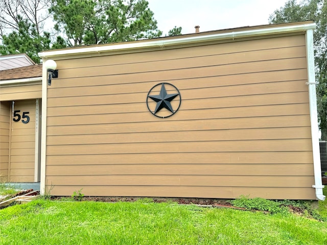 community / neighborhood sign featuring a lawn