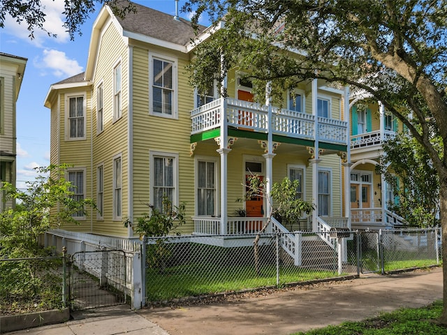 view of front of house featuring a balcony and covered porch