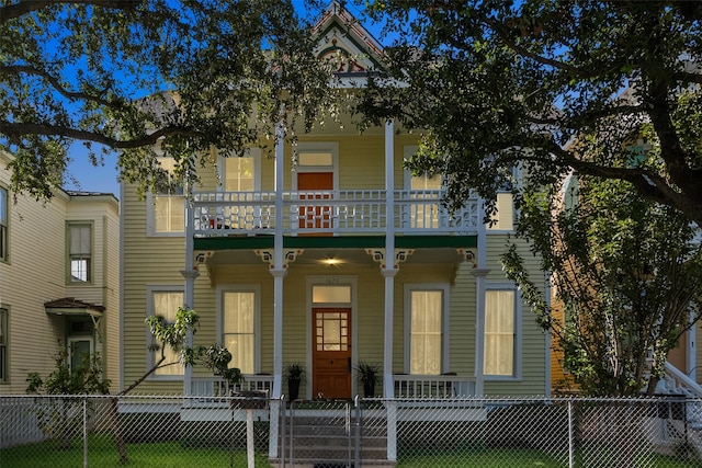 view of front of house featuring a porch and a balcony