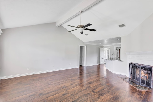 unfurnished living room featuring dark hardwood / wood-style floors, ceiling fan, beam ceiling, and high vaulted ceiling