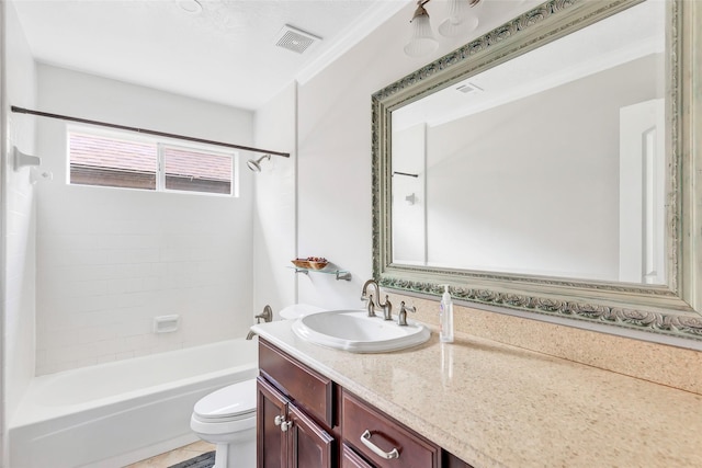 full bathroom with vanity, tiled shower / bath combo, and toilet