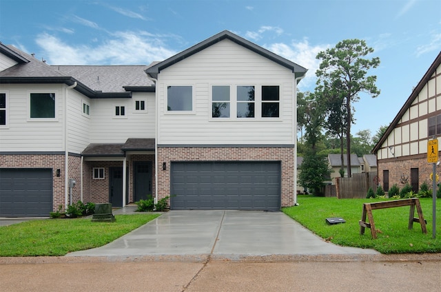 view of front facade featuring a garage and a front yard