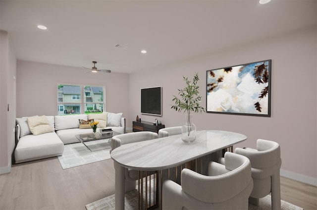 dining space featuring ceiling fan and wood-type flooring