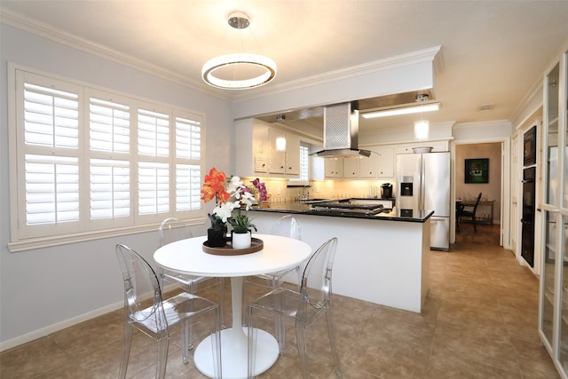 kitchen with stainless steel fridge, white cabinetry, ventilation hood, ornamental molding, and kitchen peninsula