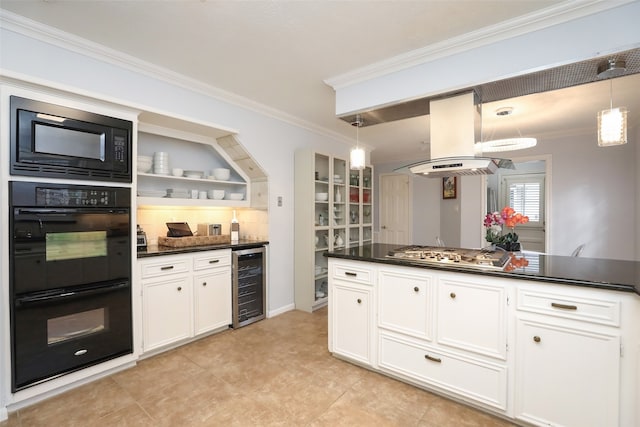 kitchen with island exhaust hood, beverage cooler, decorative light fixtures, and black appliances