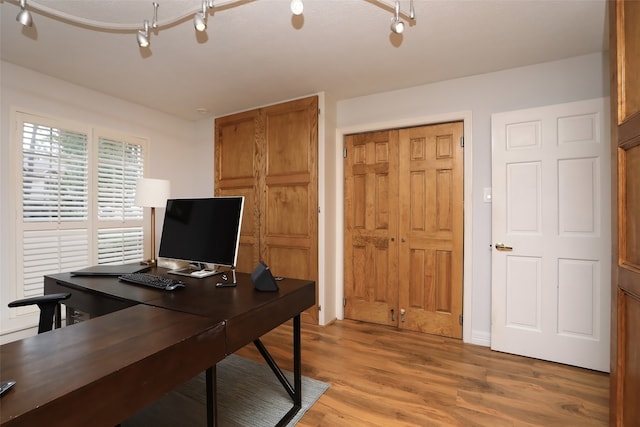 office with hardwood / wood-style flooring