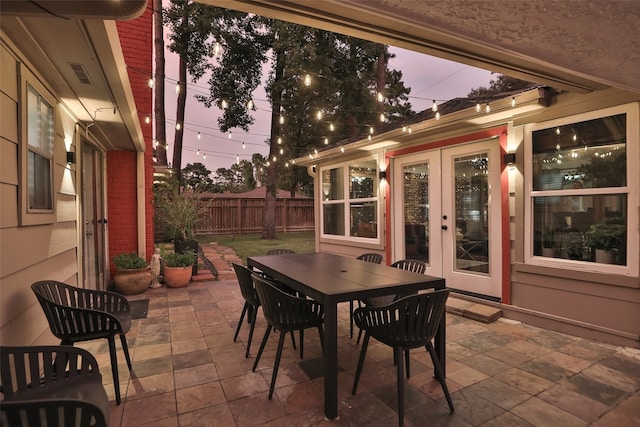 view of patio terrace at dusk