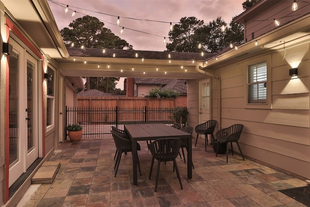 view of patio terrace at dusk