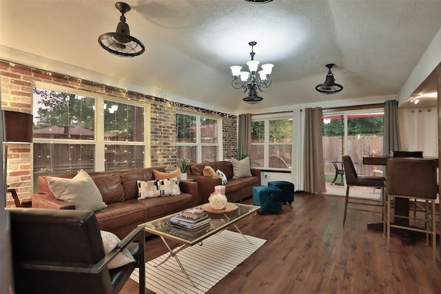 sunroom with an inviting chandelier and lofted ceiling