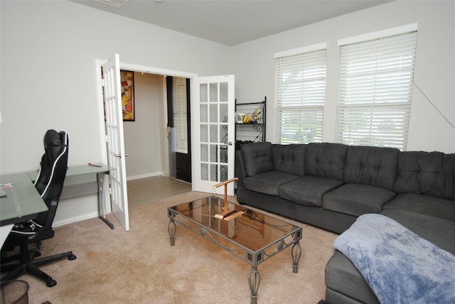 carpeted living room with french doors