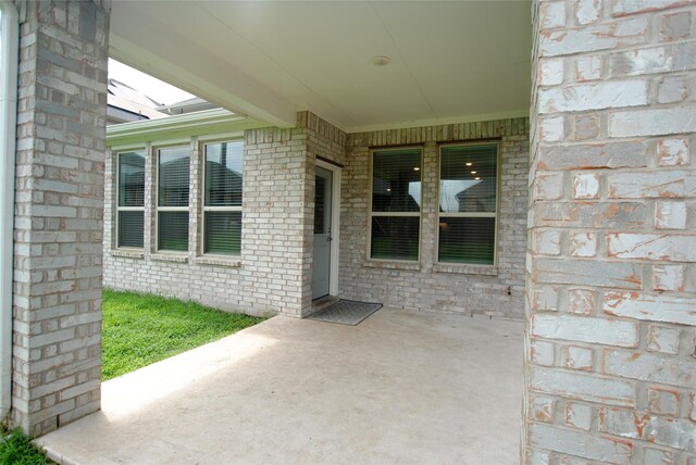 doorway to property featuring a patio