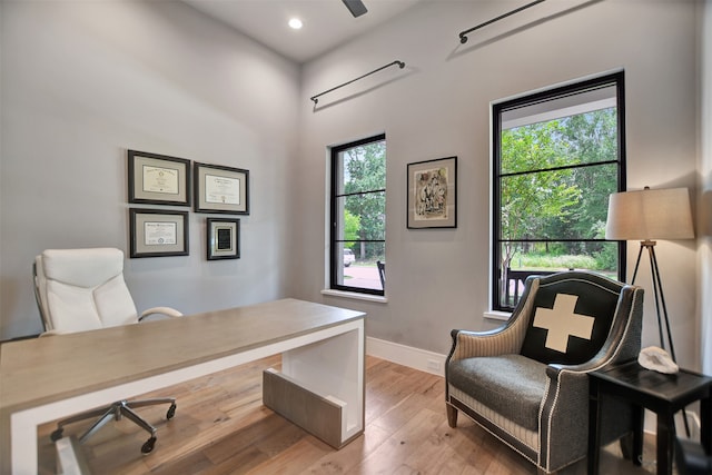 office with hardwood / wood-style flooring