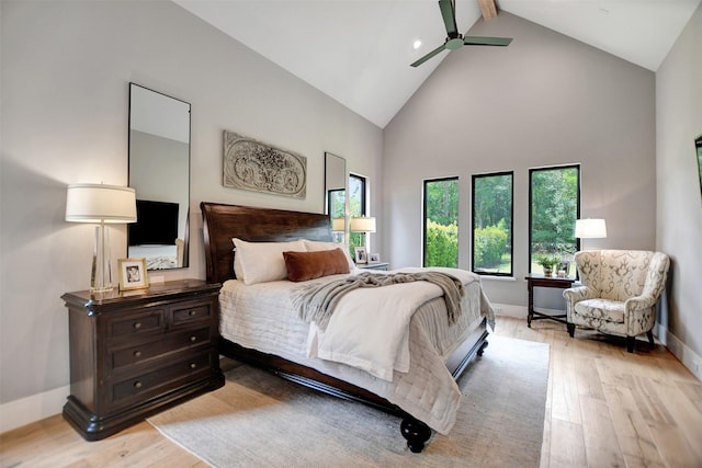 411 N Copa Palm Loop, Montgomery, TX 77316 - bedroom with beamed ceiling, light wood finished floors, baseboards, high vaulted ceiling, and a ceiling fan