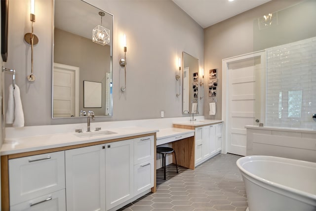 bathroom featuring tile patterned flooring, a bath, and double sink vanity