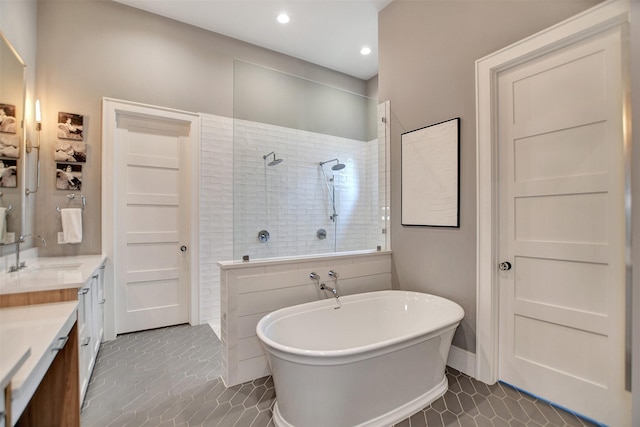 411 N Copa Palm Loop, Montgomery, TX 77316 - bathroom featuring tile patterned floors, recessed lighting, a freestanding tub, a walk in shower, and vanity