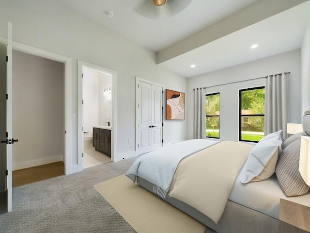 bedroom featuring carpet, ensuite bath, recessed lighting, and baseboards