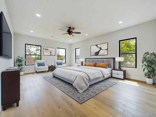 bedroom with recessed lighting, baseboards, light wood-type flooring, and ceiling fan