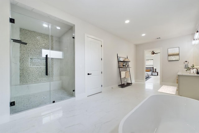 full bath featuring marble finish floor, recessed lighting, a shower stall, a soaking tub, and vanity