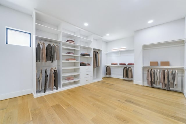 spacious closet with light wood-style floors