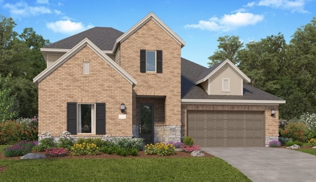 view of front of house with a garage and a front lawn