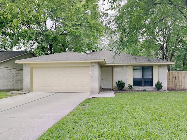 single story home featuring a garage and a front yard