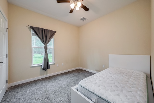 unfurnished bedroom featuring ceiling fan and carpet