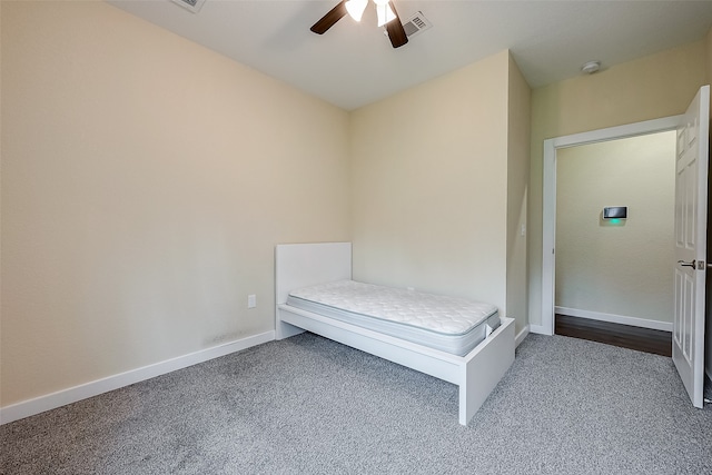 unfurnished bedroom with carpet flooring and ceiling fan