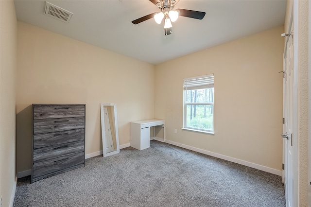 unfurnished bedroom featuring ceiling fan and carpet