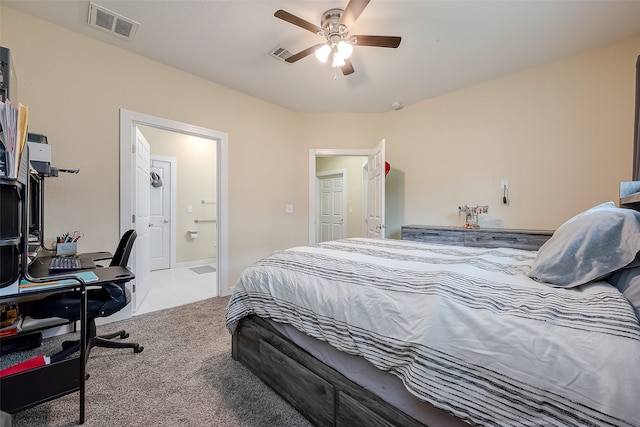 carpeted bedroom with ceiling fan and connected bathroom