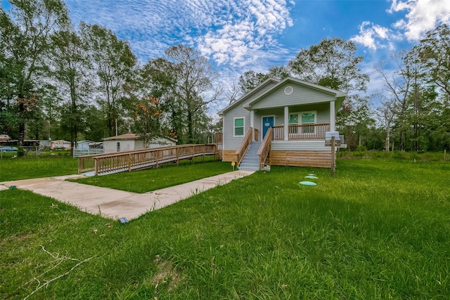 view of front of property with a porch and a front yard