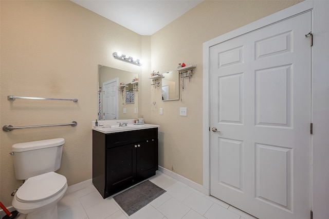 bathroom with tile patterned floors, vanity, and toilet