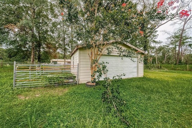 exterior space featuring an outbuilding and a garage