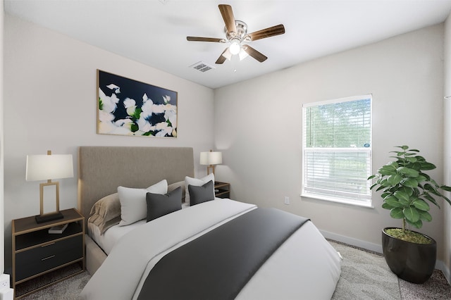 bedroom featuring light carpet and ceiling fan