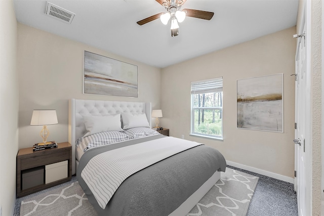 bedroom with ceiling fan and light colored carpet